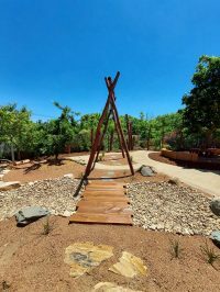 Photo of the dry creek with a sensory path